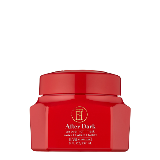 a red jar of after dark cream on a black background