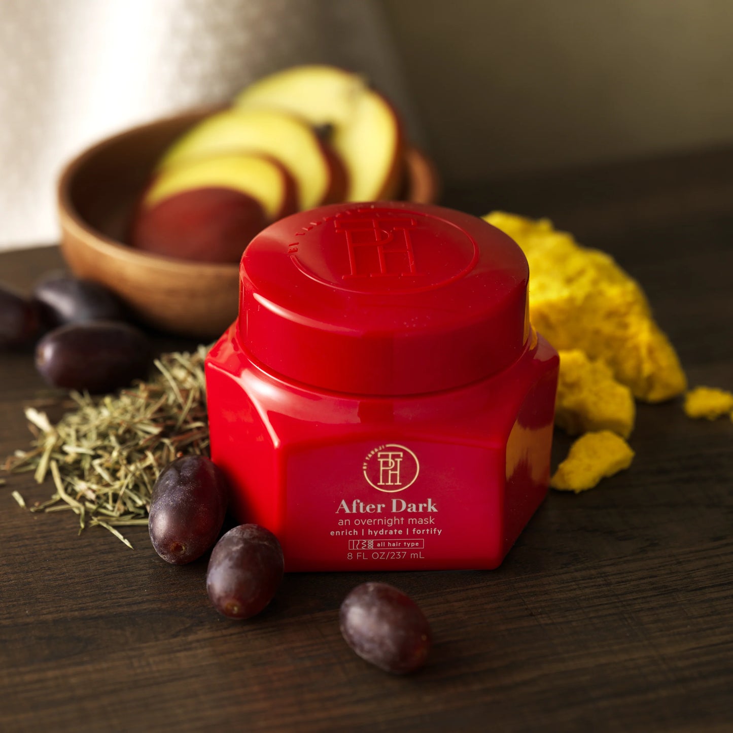 a red container sitting on top of a wooden table